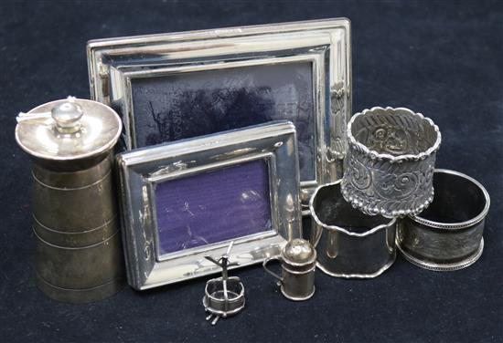 Three silver napkin, silver pepper mill, 2 photo frames, a miniature pepperette and an 800 silver snare drum on stand with sticks